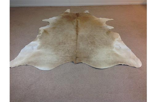 BUTTER CREAM AND WHITE COWHIDE RUGS